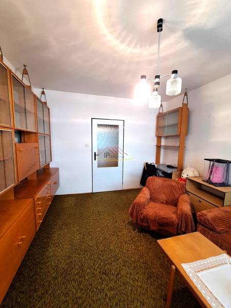 Living room in a 3-room apartment with furniture, a sofa, and carpet flooring.