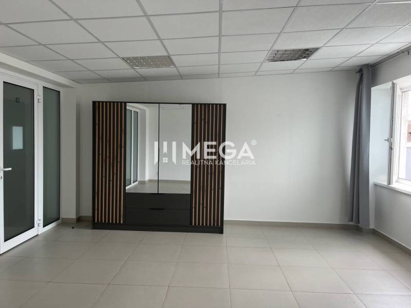 Offices with an elegant cabinet and white walls, available for rent.