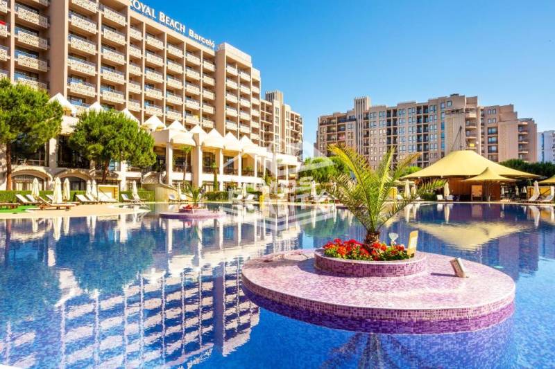 A holiday resort on the Sunny Beach with a large pool and relaxation areas.