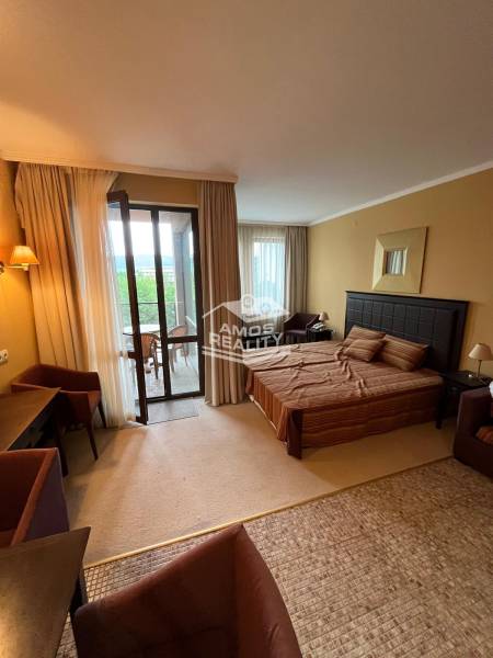 A recreational apartment with a bedroom, terrace, and comfortable furniture for a relaxing stay.