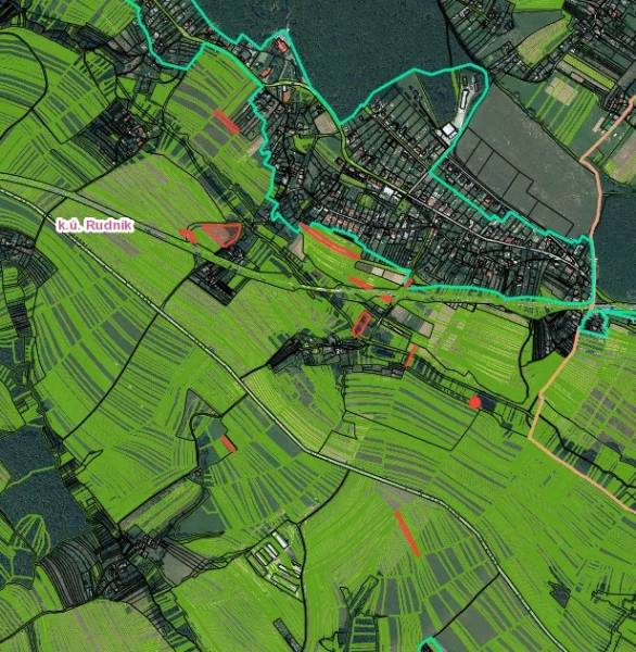 Map of agricultural and forest land near Rudník with color-coded parcels.