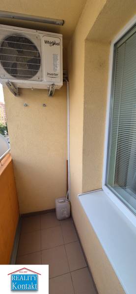 Balcony in a 1-room apartment with air conditioning, suitable for relaxation.