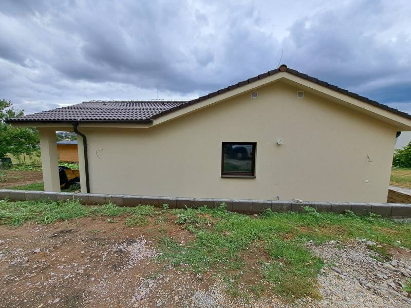 A family house in Malý Lapáš with a simple facade and a gable roof.