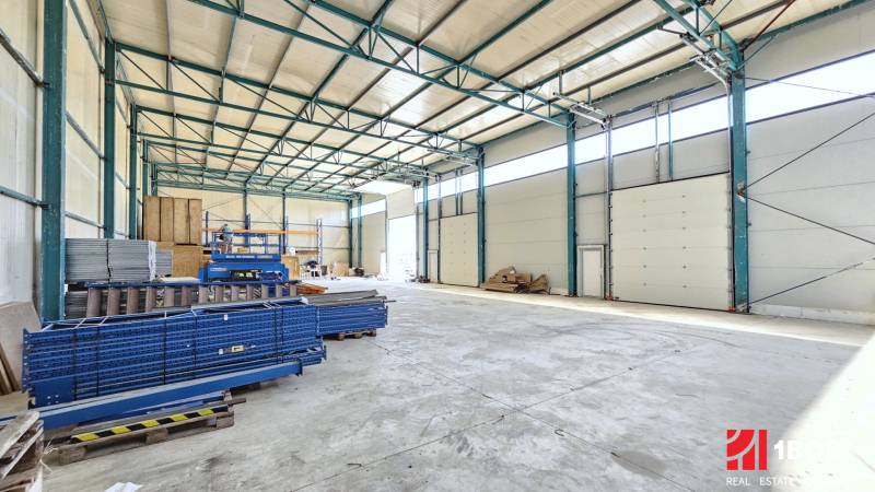 Storage space with shelving units and industrial doors, Commercial premises.