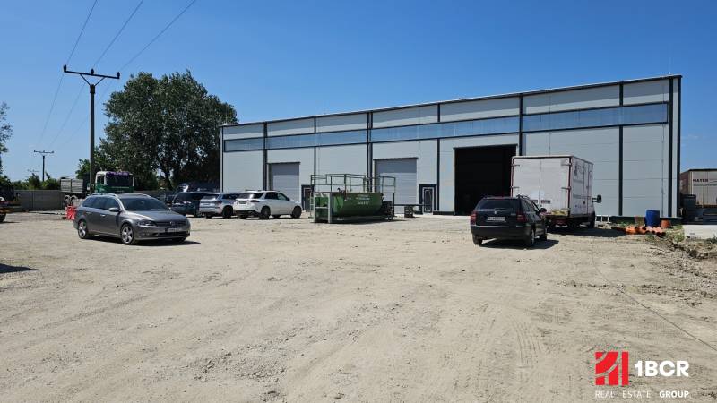 Commercial premises on Domové role Street in Bratislava - Ružinov. Several cars parked.