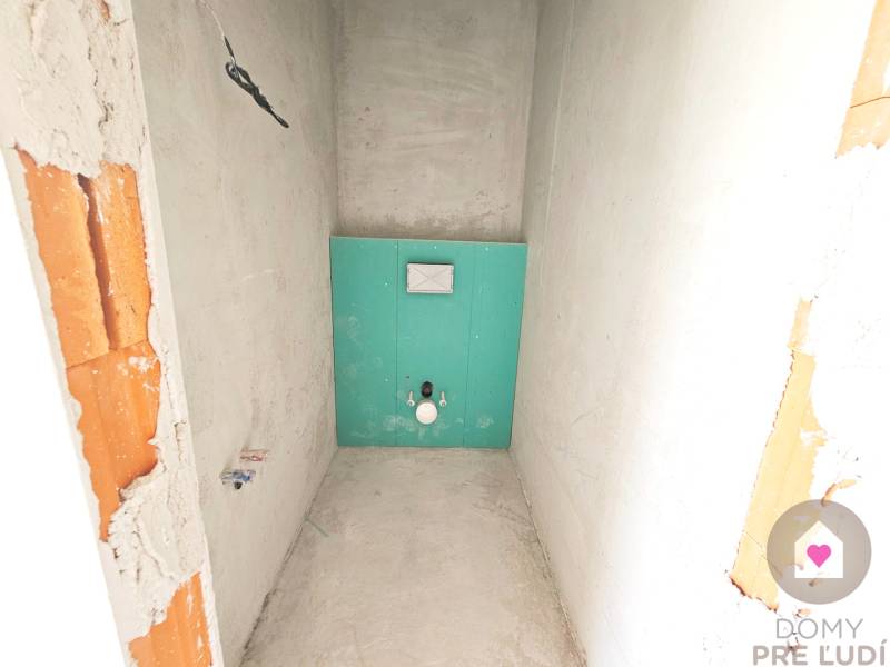 Interior of a family house with installation for a toilet, ready for further modification.