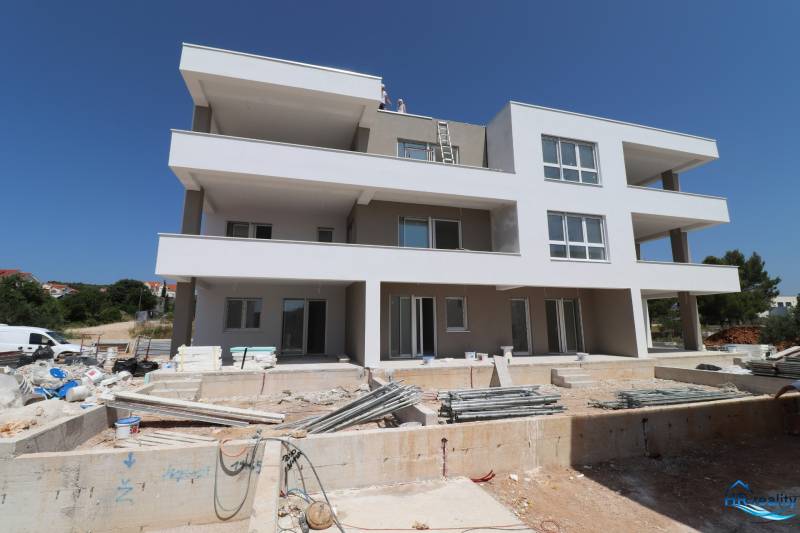 A recreational apartment in the town of Vodice on Stablinac Street with an unfinished exterior.