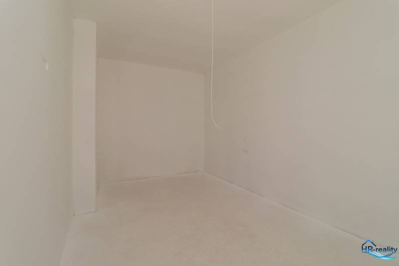 Empty interior with white walls and floor in a Holiday Apartment.
