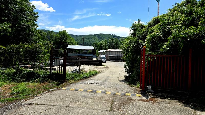 An industrial area in Banská Bystrica surrounded by greenery, typical for warehouses and halls.