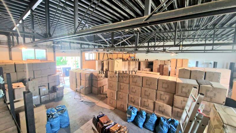 Warehouses and halls full of boxes and bags indoors.