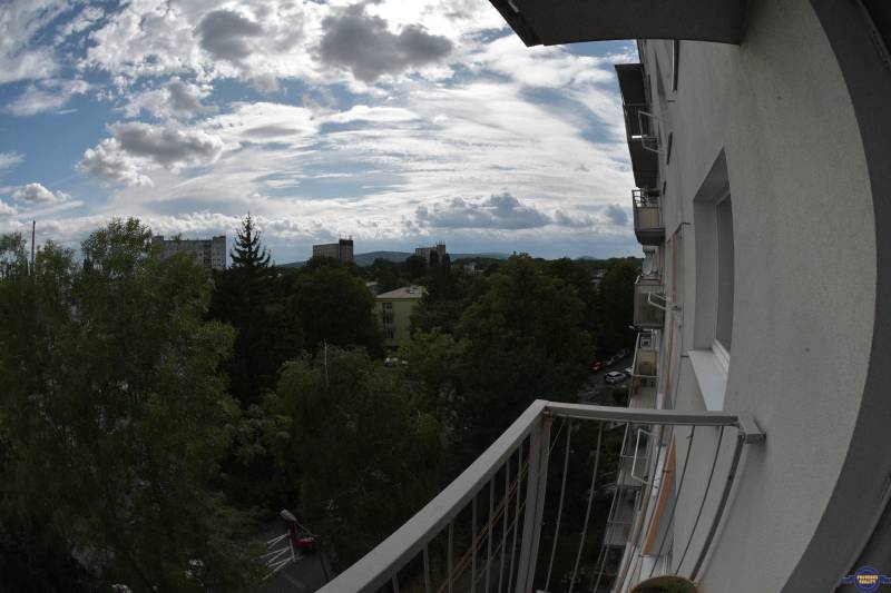View from the balcony in Bratislava - Petržalka with a panorama of trees and sky.