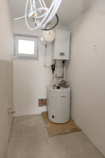 Heating and boiler in the utility room of a family house, ready for use.