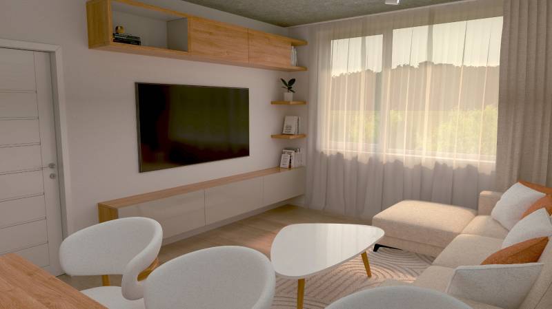 Living room in a two-room apartment with a TV, sofa, and light furniture.
