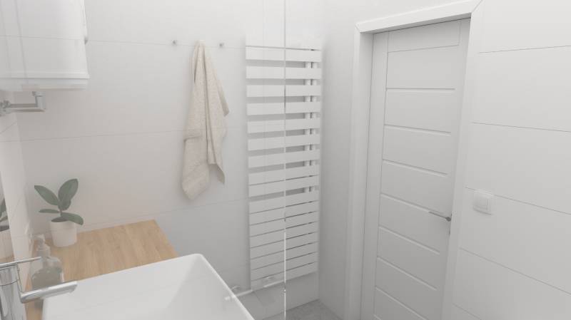 A bathroom with a white radiator, a sink, and a wooden countertop in a 2-room apartment.