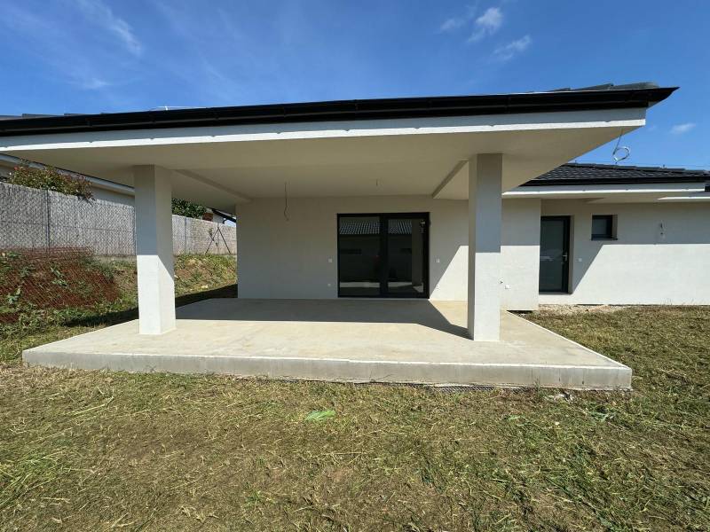 Family house in Kynk, Nitra with a covered terrace and grassy plot.