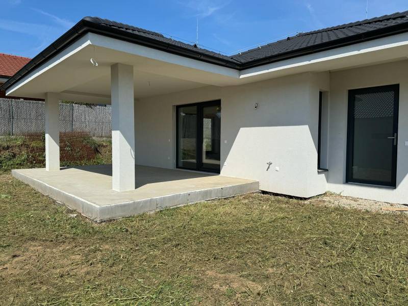 A family house in Kynek, Nitra with a terrace and a grassy plot.