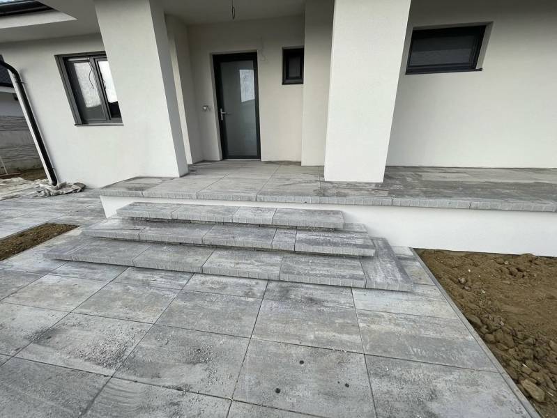 Entrance steps with gray tiles in a family house in Western Slovakia.