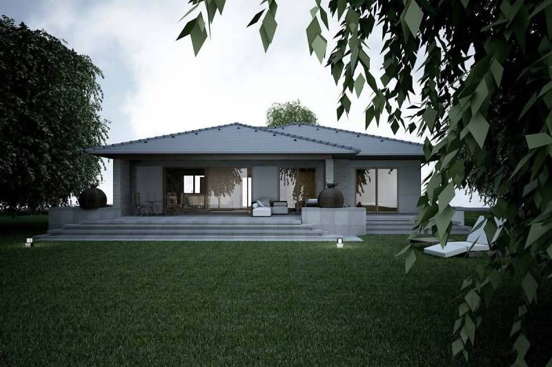 A family house in Western Slovakia with a large terrace, surrounded by greenery and a well-maintained garden.