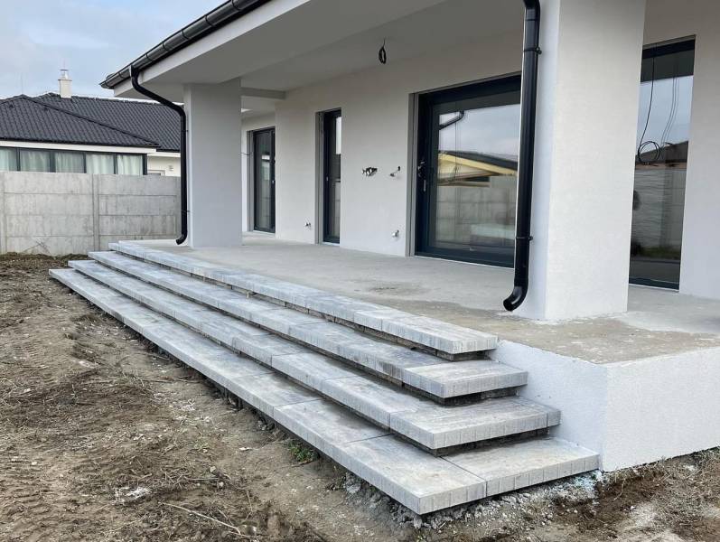 Family house in Western Slovakia with a concrete terrace and stairs, ready for completion.