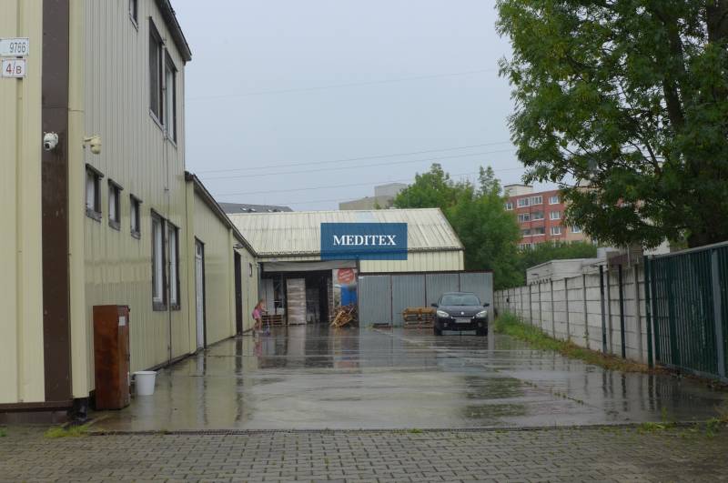 Buildings with warehouses and halls in Bratislava - Rača on a rainy day.
