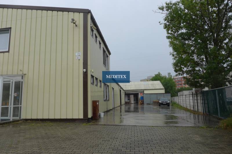 The exterior of warehouses and halls in Bratislava - Rača during a rainy day.