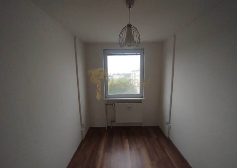 A room in a 3-room apartment with light and wooden flooring, suitable for customization.