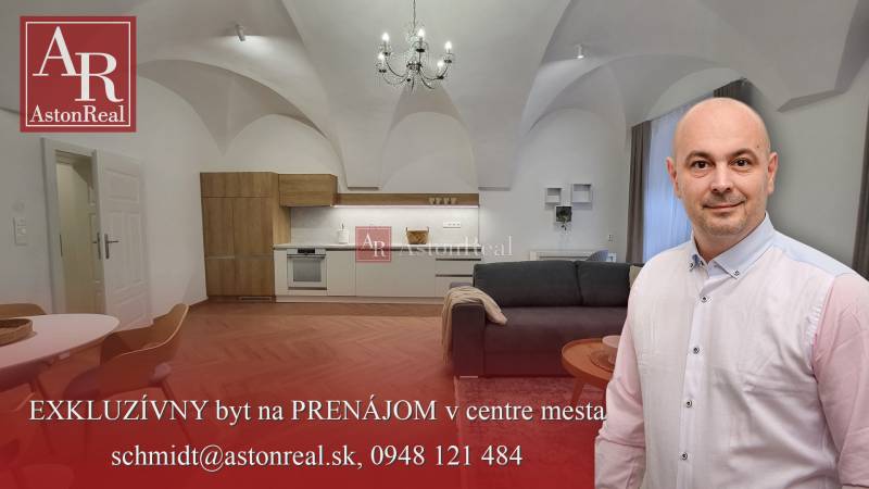2-bedroom apartment with vaulted ceilings, a modern kitchen, and a comfortable living room with a chandelier.