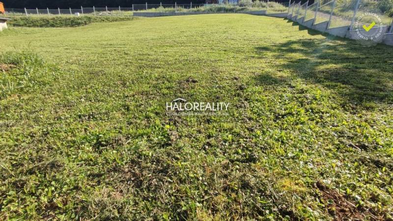 A garden in Horná Ves suitable for residential plots, covered with grass and fenced.