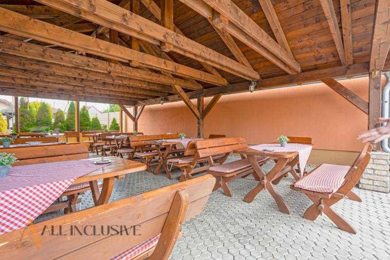 Wooden terrace with benches in hotels and guesthouses in Veľký Meder.