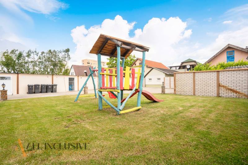 Children's playground with a wooden structure in the area of hotels and guesthouses in Veľký Meder.
