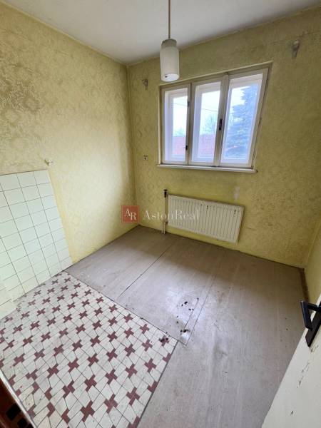 An empty room on Lietavská Lúčka Street, awaiting renovation in a 3-room apartment.