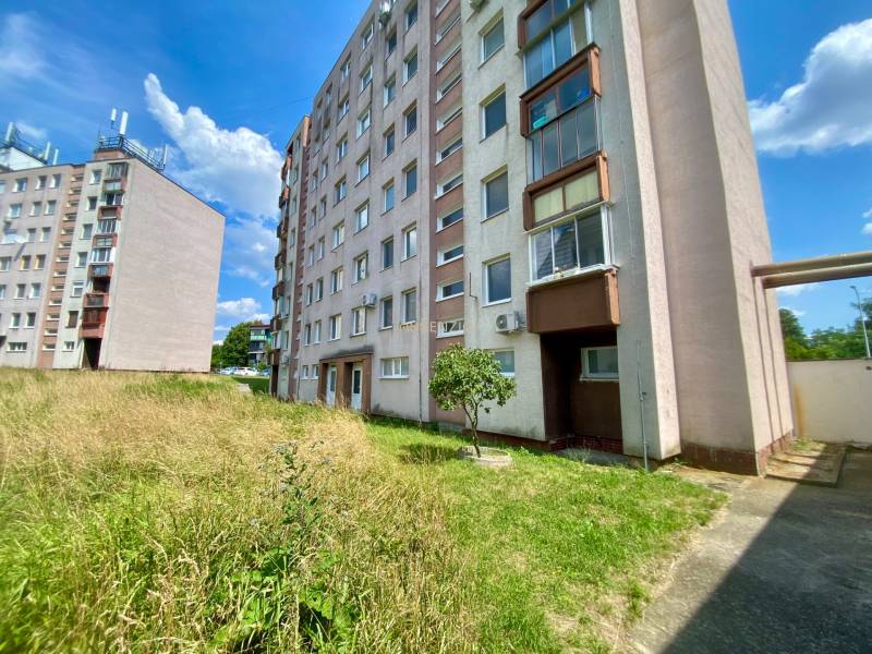 Apartment buildings with greenery and blue sky on Jilemnického Street in Stupava.