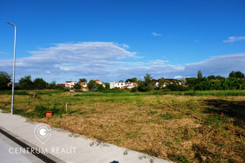 Plots - residential on Cintorínska Street in Malinovo, grassy areas next to the sidewalk.