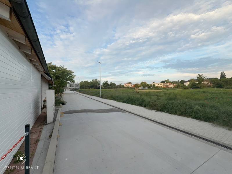 Residential plots in Malinovo on Cintorínska Street with a view of nature and the road.