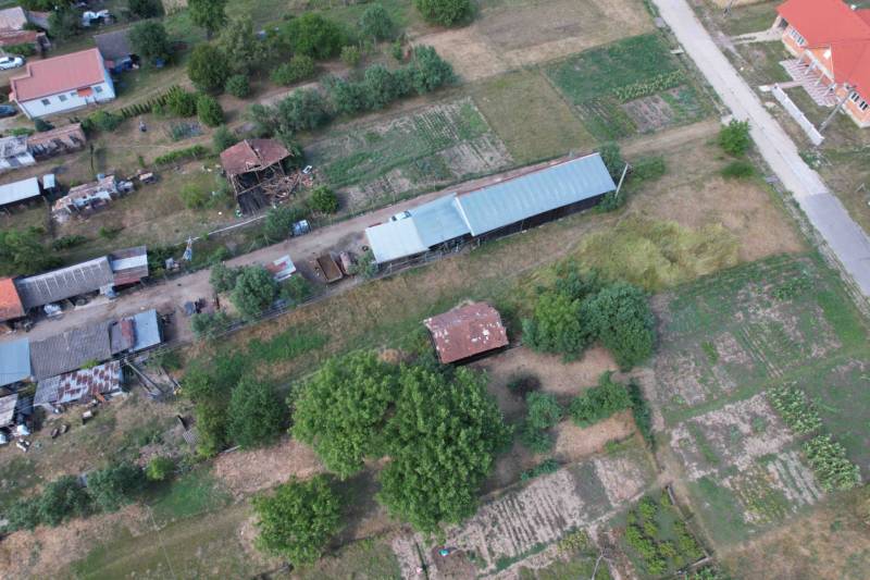 Visible construction of houses in Štrkovec with agricultural fields and buildings.