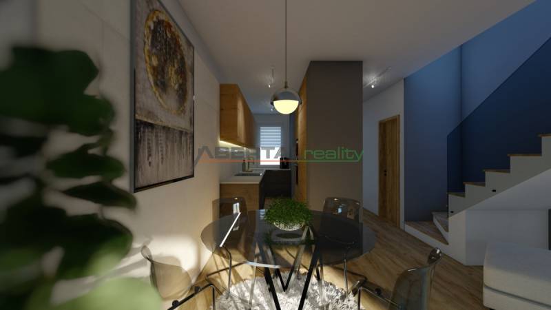 Dining table with chairs, staircase, and kitchen in a 4-room apartment.