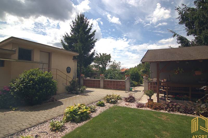 Family house on Športová Street in Brodské, garden with a gazebo and a neat lawn.