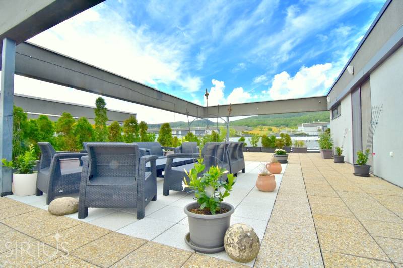Rooftop terrace with garden furniture and a view of the surroundings in Bratislava - Rača.