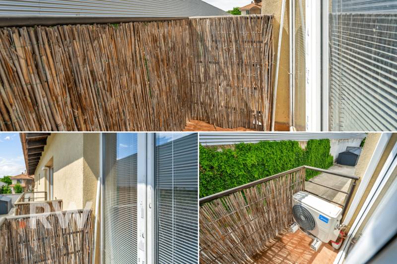 Balcony of a 3-room apartment with reed covering, air conditioning, and a view of the courtyards.