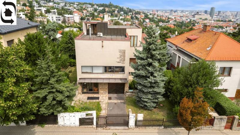 A family house on Mudroňova Street in Bratislava - Staré Mesto with greenery in the background.
