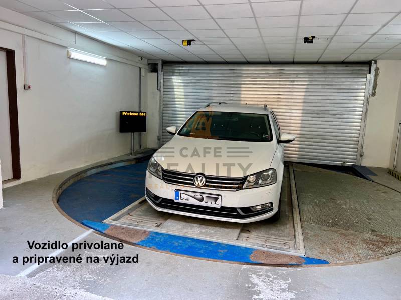 Car in the underground garage ready for departure, garage signal displayed.