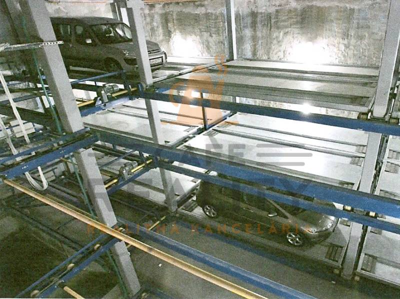 Parking system and garages: Multi-level parking with cars inside the building.