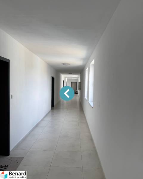 A long corridor in Poprad on Hurbanova Street, leading to 2-room apartments.