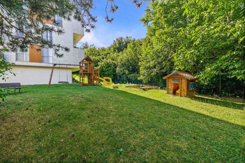 Exterior of a 3-room apartment on Martina Granca Street in Bratislava – Dúbravka with a children's playground.