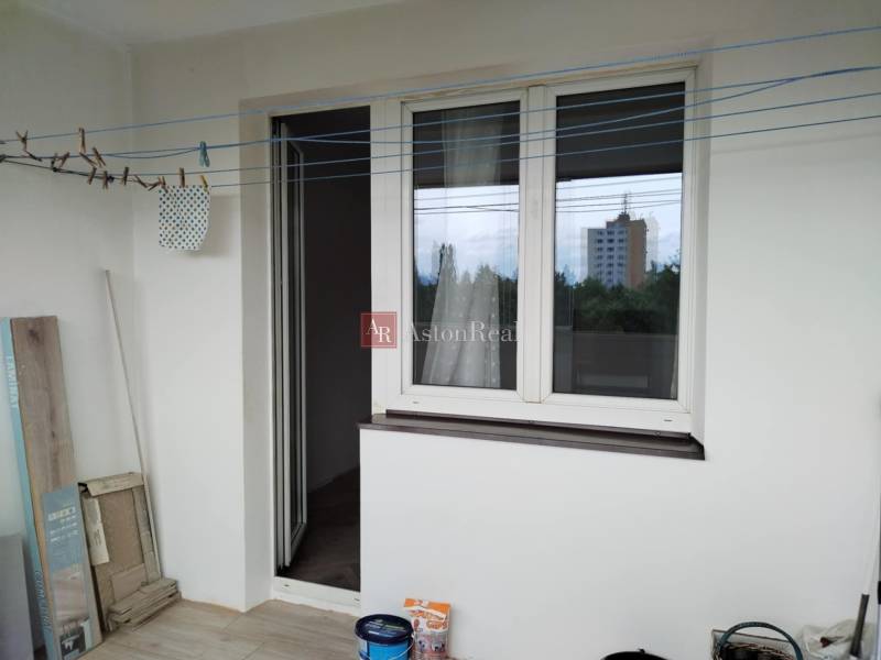 A balcony of a 2-room apartment with a view of the city.