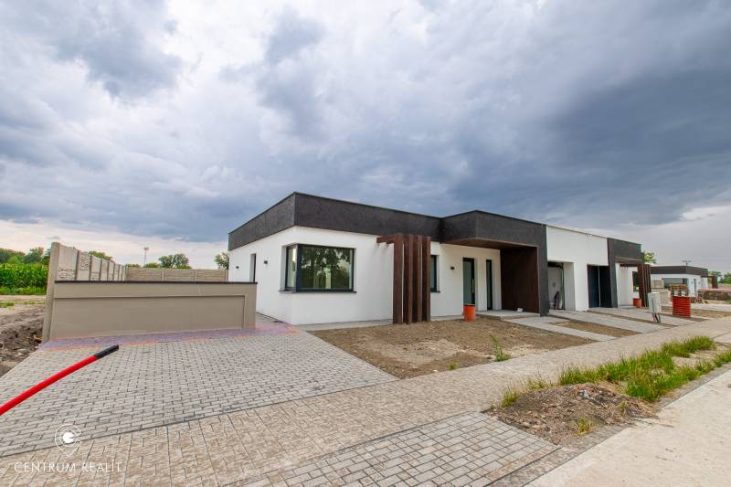 A family house in Vrakúň, Dunajská Streda, with interlocking paving and minimalist architecture.