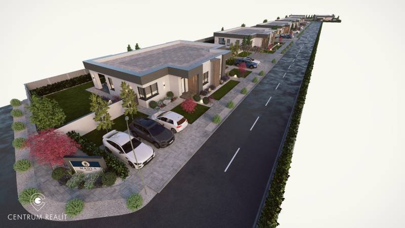 Row housing of family houses on Vrakúň Street in Dunajská Streda, adjacent parking spaces.