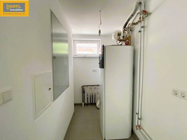 Utility room in a 5 or more bedroom apartment with a boiler and piping.