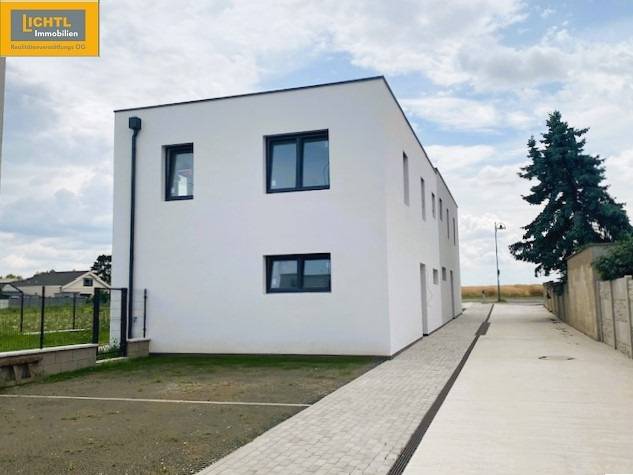 A view of a modern building in Bratislava with a reinforced access road.