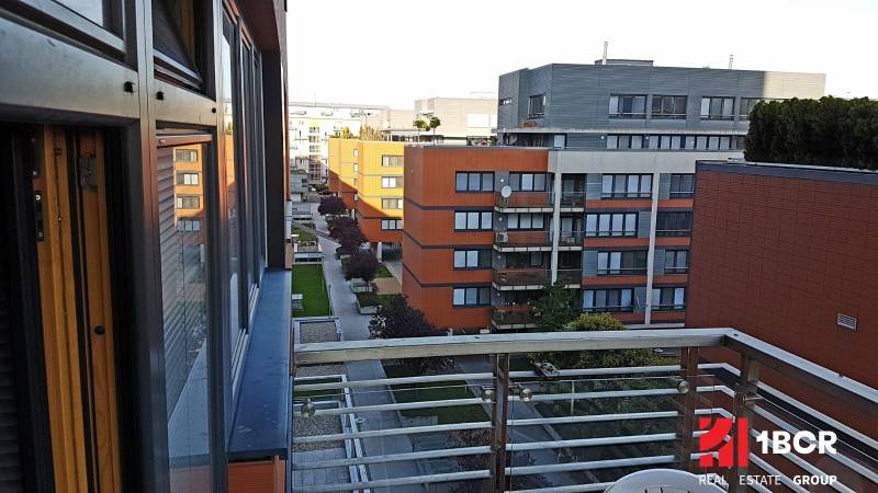 A view from the window of a courtyard with greenery and buildings in Bratislava - Ružinov.